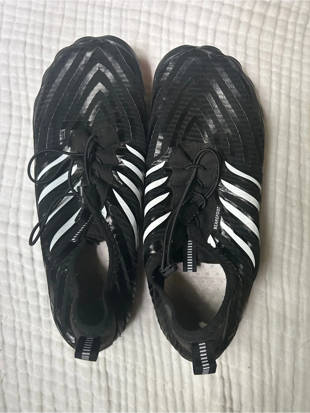 Black Barefoot Athletic-Style Shoes with White Stripes